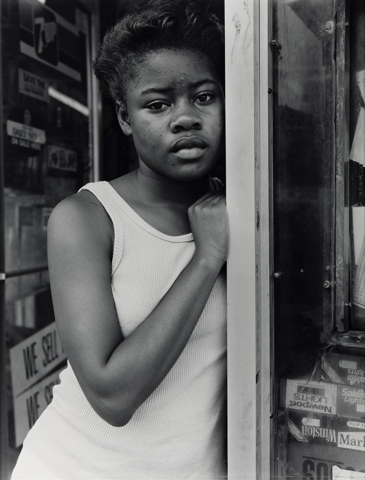 DAWOUD BEY (1953 - ) A Girl in Deli Doorway, Brooklyn, NY.